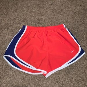 Red Nike running shorts. Size M